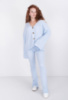 Жіночий блакитний трикотажний костюм з кофтою на ґудзиках