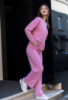 Жіночий рожевий спортивний костюм