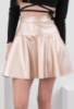 Жіноча спідниця золотистого кольору із еко-шкіри
