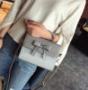 Стильная женская сумочка с бантиком Серый