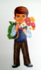 Фігурний плакат з вирубкою «Хлопчик-школяр з квітами». (Етюд)