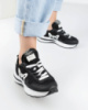 Жіночі чорно-білі кросівки