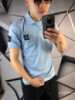 Поло Stone Island голубого цвета с патчем на рукаве mf037