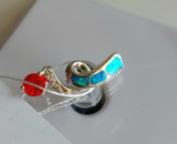 Срібний кулон з опалом та гранатом та безбарвними топазами