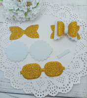 Вирубка бантик з хвилястими краями золото-білий 6,5*4,5 см з фоамірану з глітером,набір деталей.