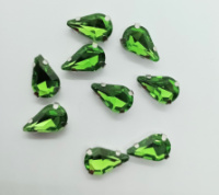 Страз (стекло)  в металлической оправе. Размер - 8×13 мм. Цвет - зелёный