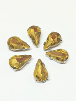 Страз (стекло)  в металлической оправе. Размер - 8×13 мм. Цвет темно желтый