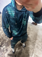 Зелений спортивний костюм з написами та принтом