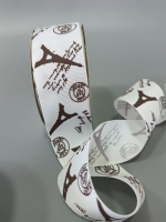 Репсовая лента. Ширина - 4 см. Цвет - черные башни на белом фоне.. Цена указана за 1 метр