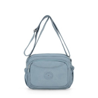 Маленьке жіноче кросбоді текстиль блакитного кольору 7683BL